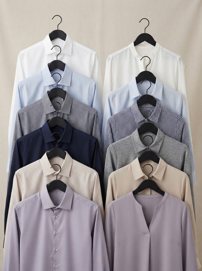 Pressed formal shirts and blouses in office-appropriate colours on hangers, 3:4 crop